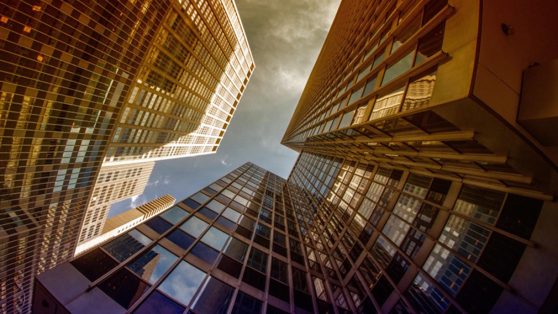 View of office buildings looking up from ground level.