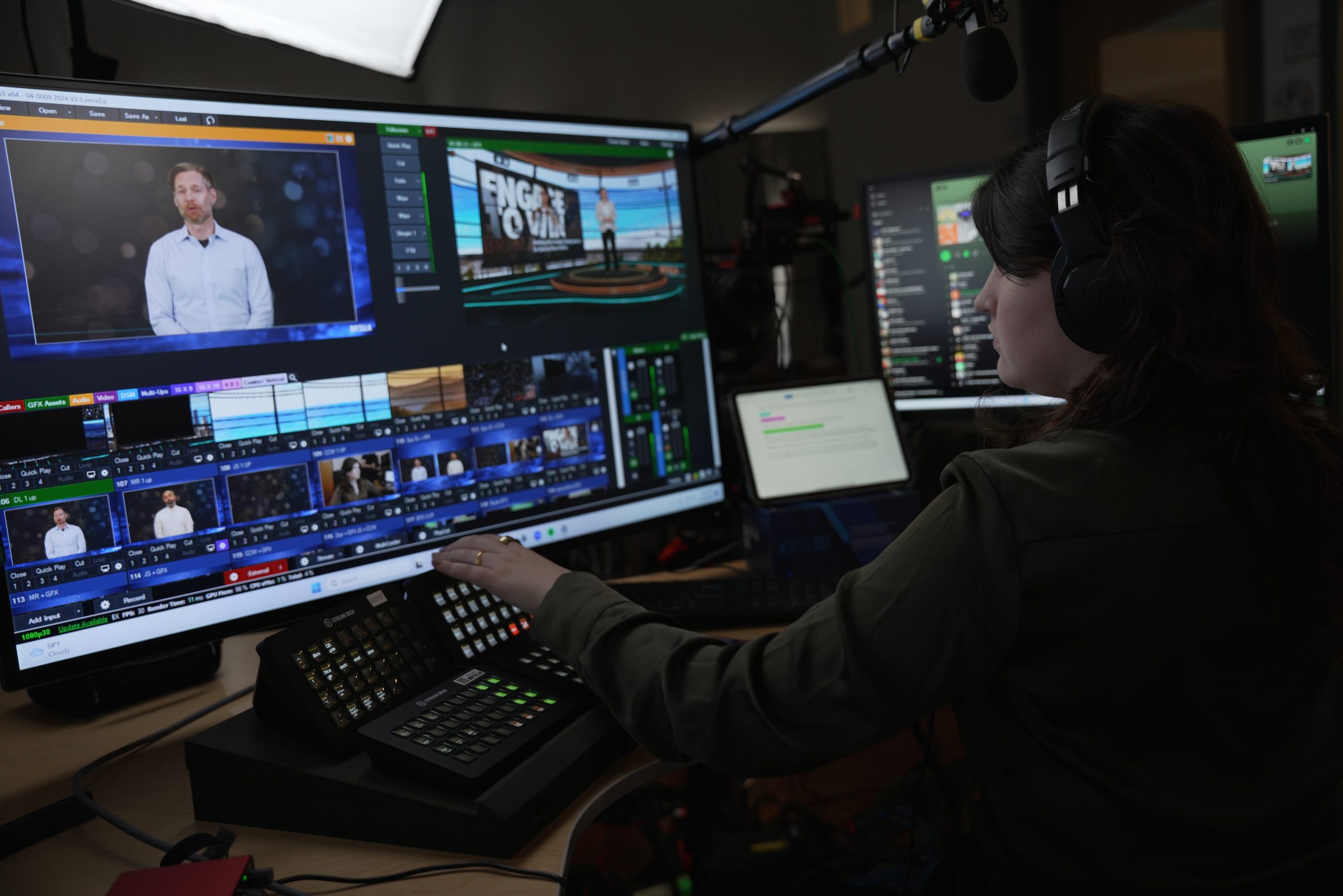 A female Brella event mangement agency producer monitors a virtual livestream.